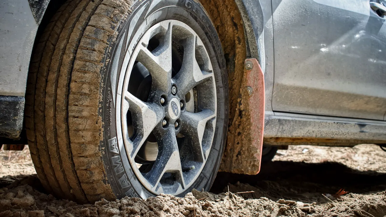 Close up of tire sidewall showing load index and size markings
