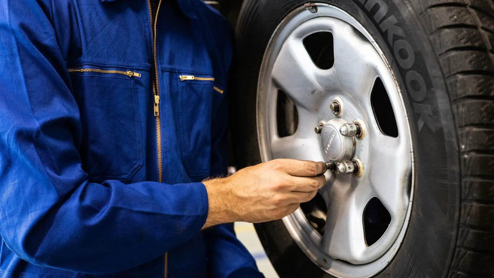 An engineer examines a tire cross section during a supplier quality audit.