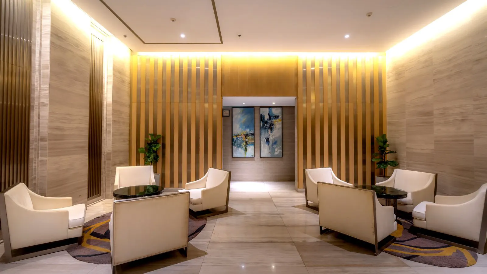 Modern seating arrangement in a bright hotel lobby reception area