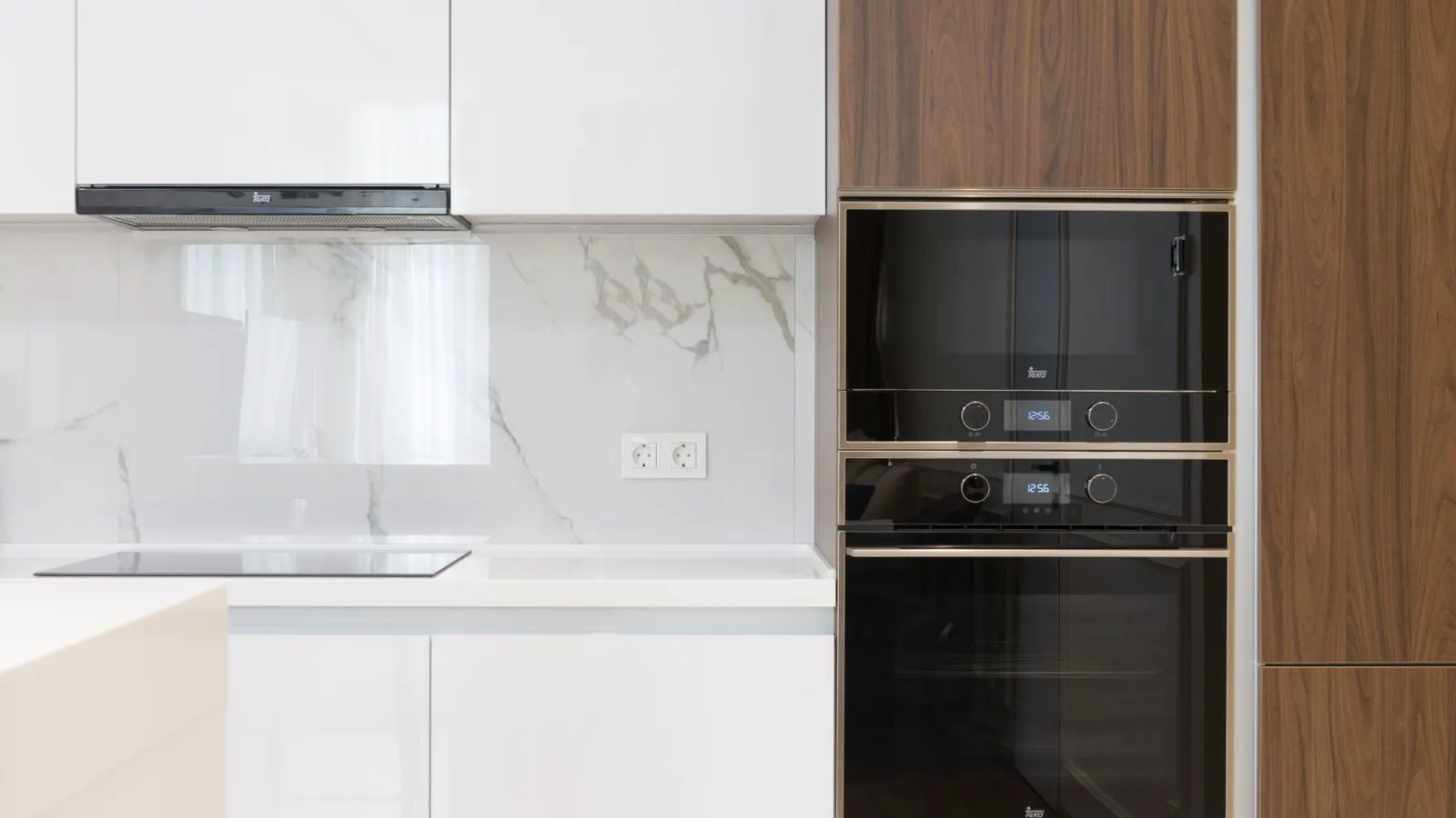 Engineer inspecting stainless steel appliance interior for food contact compliance