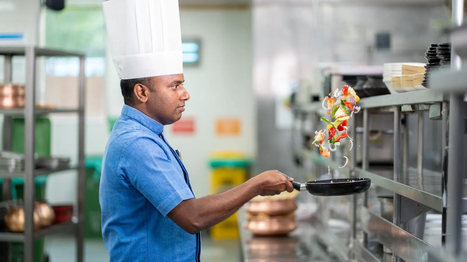 A contractor reviews a financing contract near a stainless steel oven