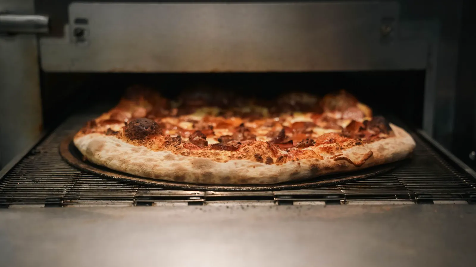 Close view of a convection oven fan and rack setup