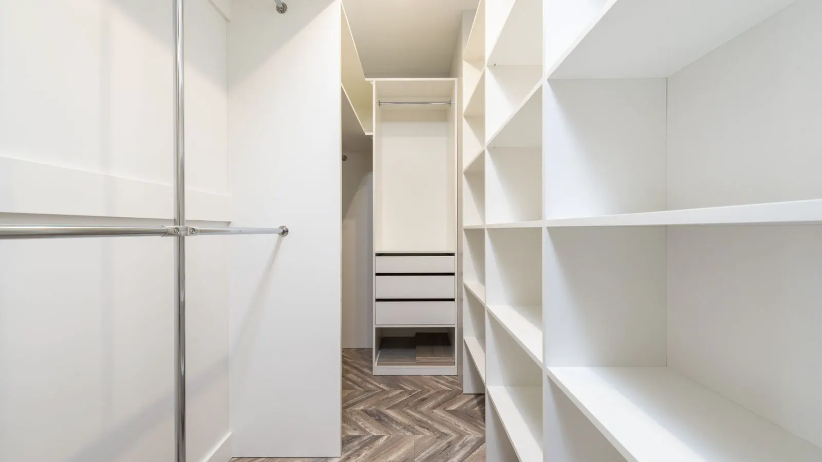 Interior view of a clean commercial walk-in cooler with white walls