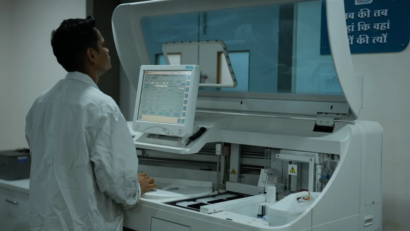 A clean laboratory bench with automated sample processing equipment