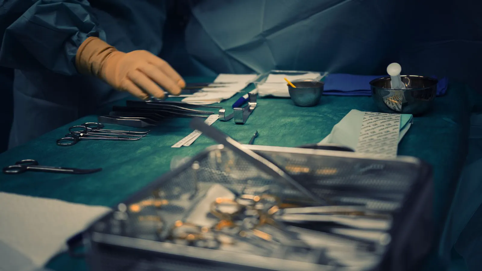 Stainless steel surgical instruments arranged on a sterile tray
