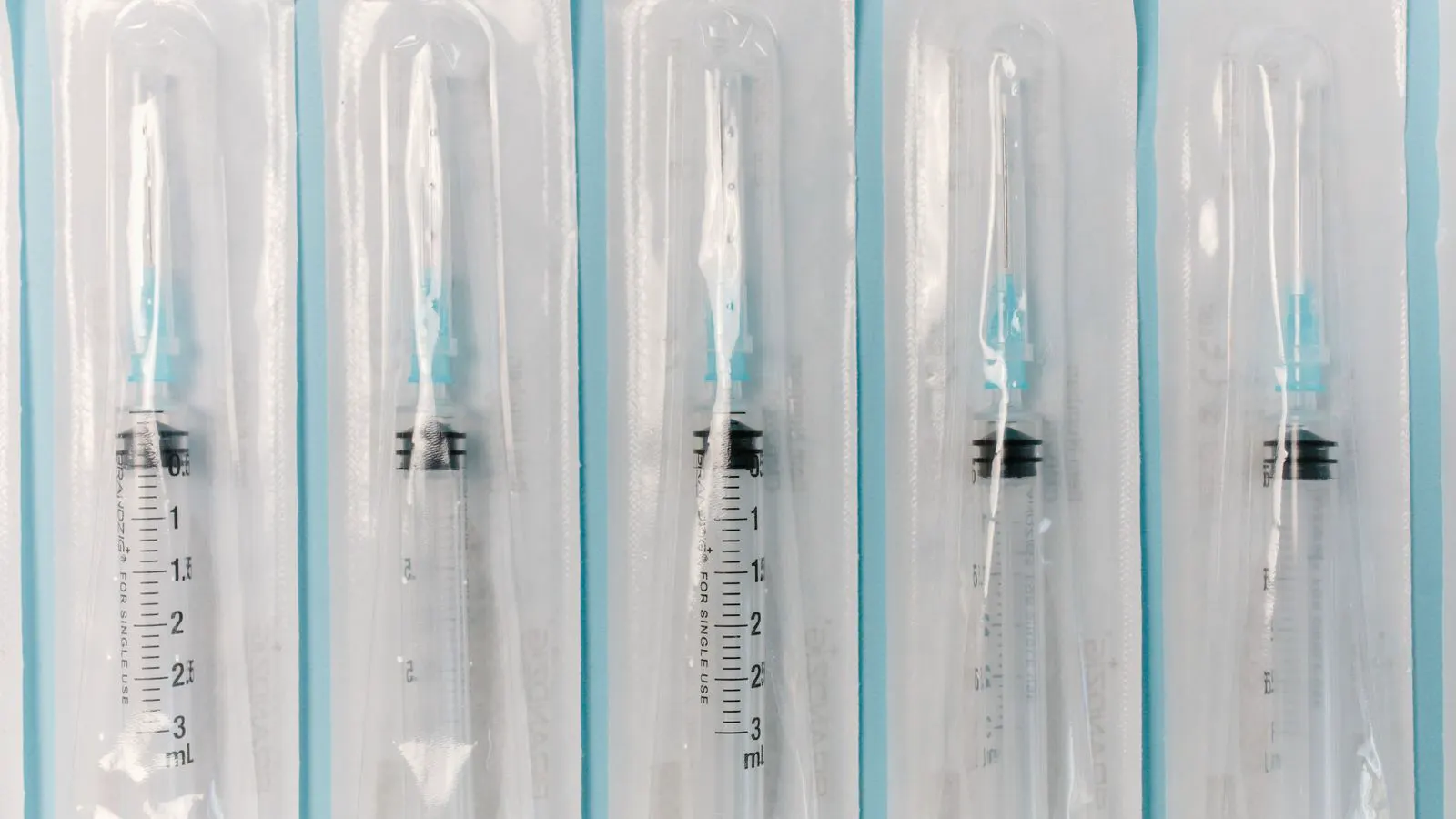 Inspector checks sterile medical packaging and documentation