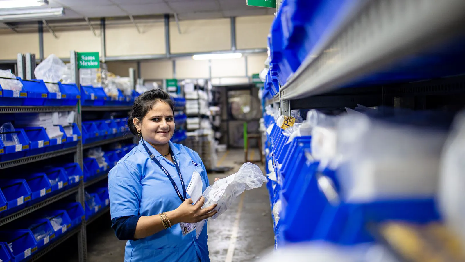Shelves stocked with sealed medical consumables in a distribution center.