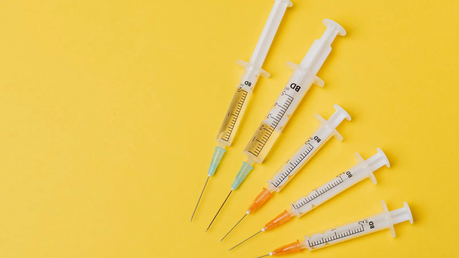 Close view of syringe packaging and printed lot codes