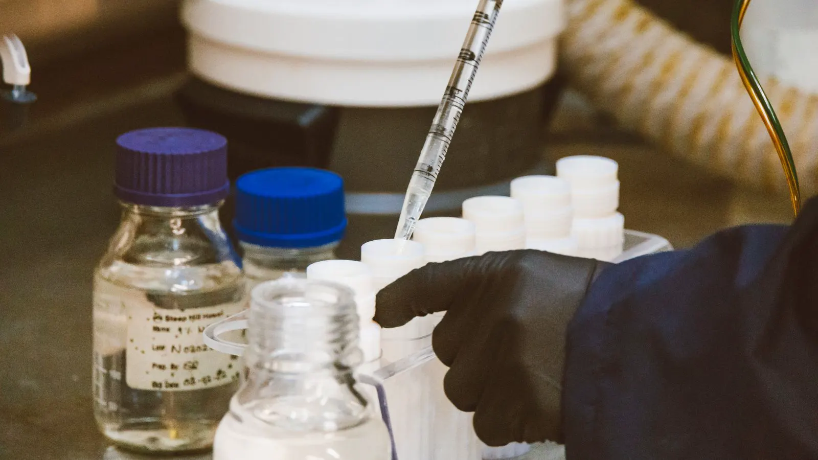 A certified reference material vial sitting on a lab bench