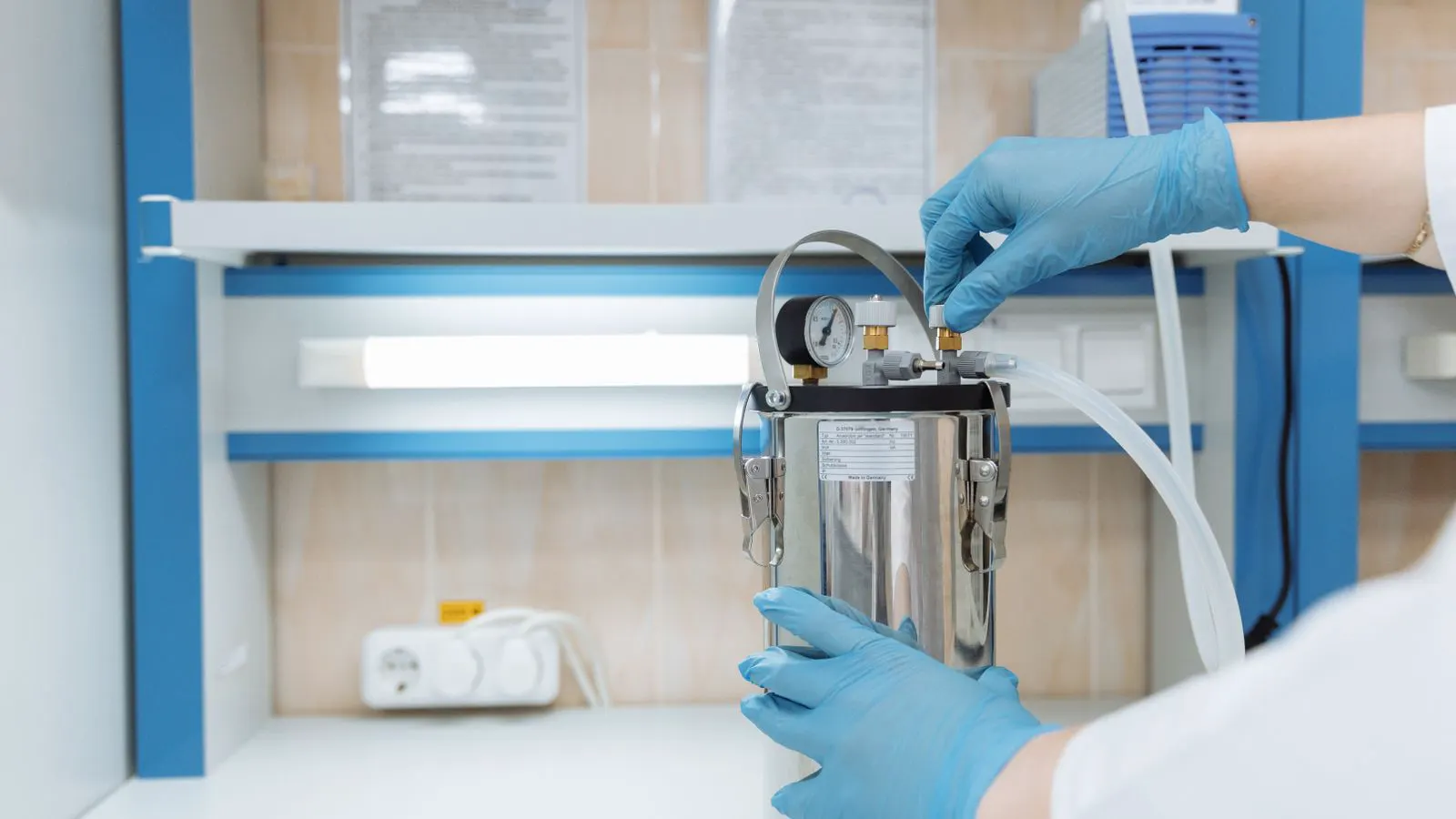A professional reviewing a laboratory equipment sourcing plan at a desk.