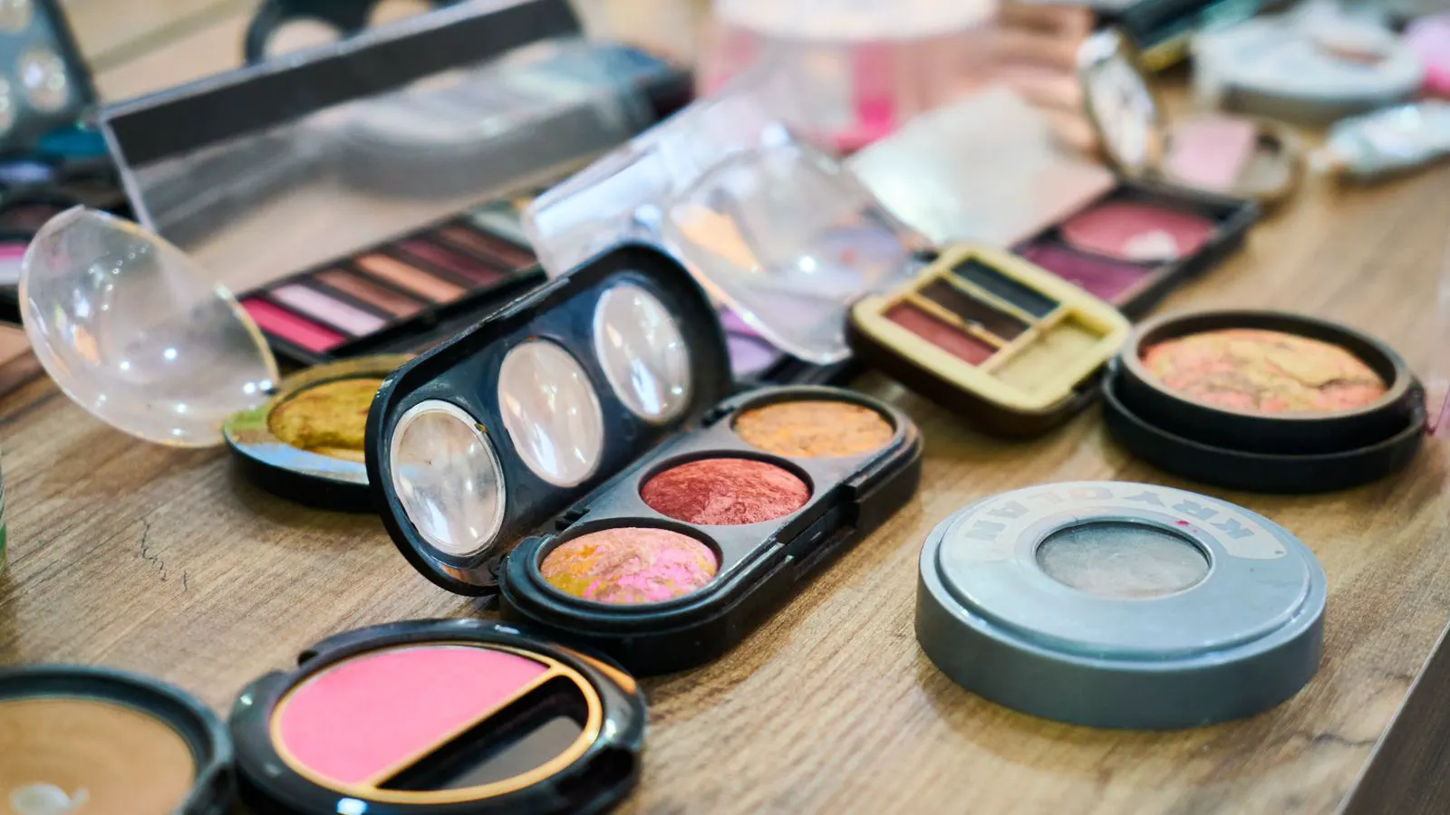 A laboratory bench with labeled samples of various cosmetic raw materials