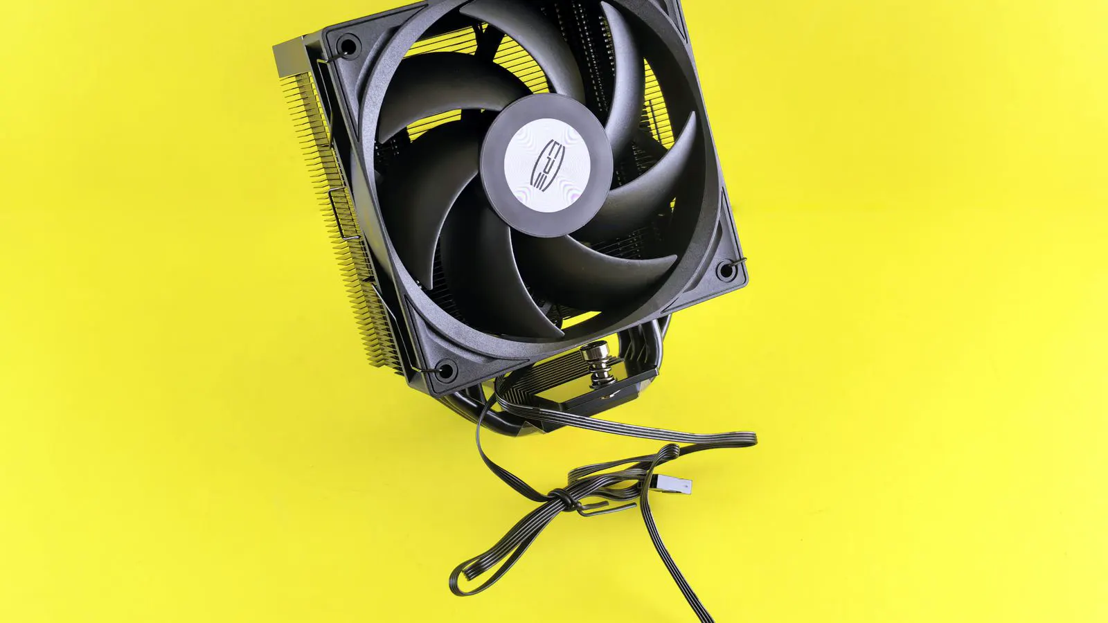 Close view of an oil cooler fan assembly on a machine