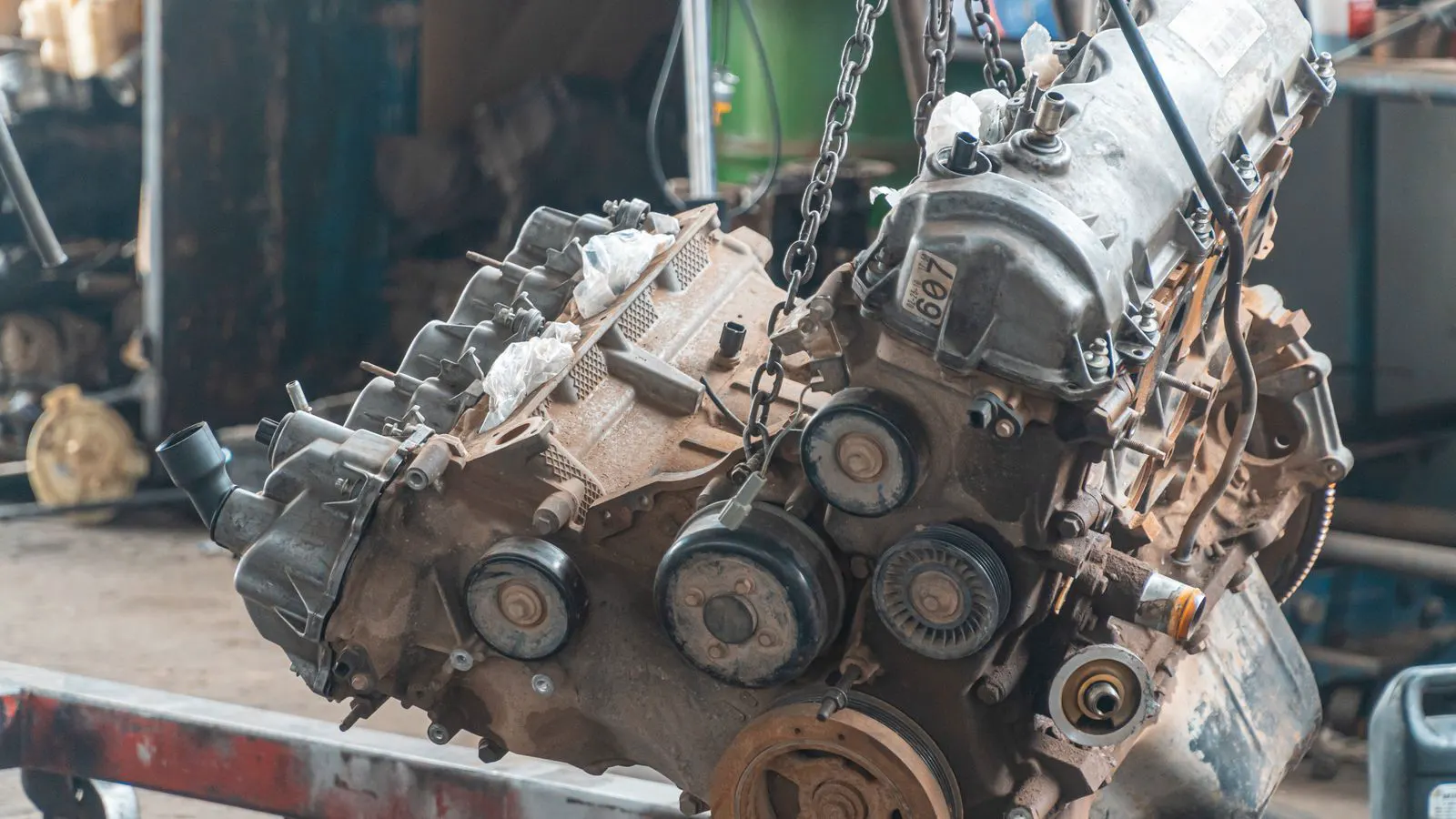 Technician checking gauge readings on a large industrial compressor
