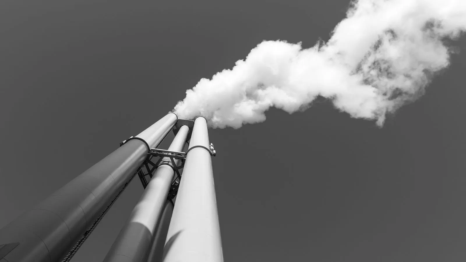 A close view of a cylindrical air intake filter attached to a compressor