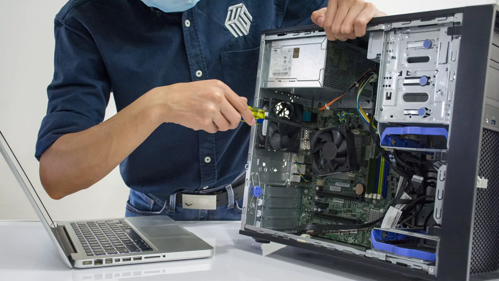 A technician carefully installs a new filter cartridge into a treatment unit.