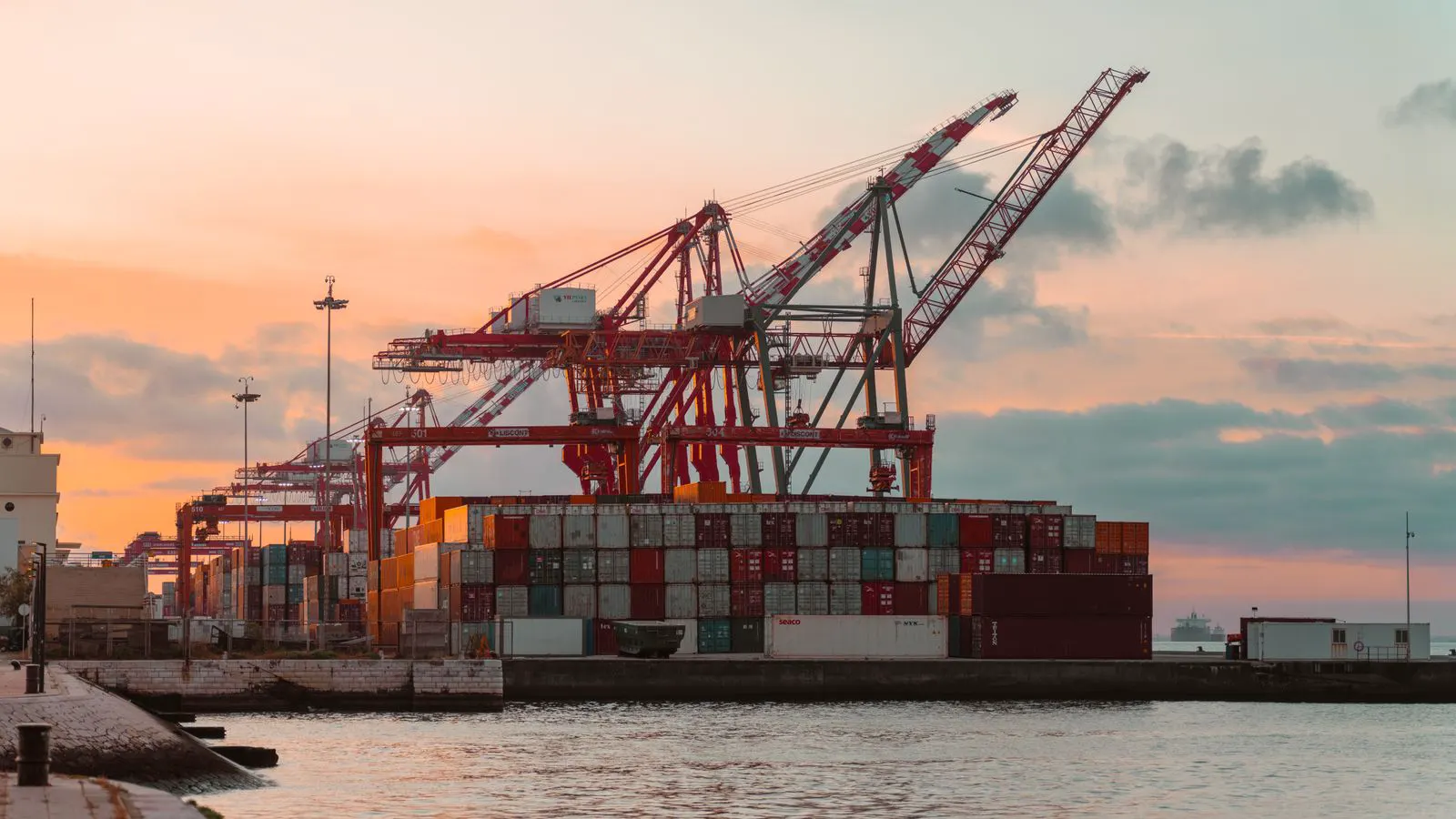 A large industrial air dryer container sits at a port gate.