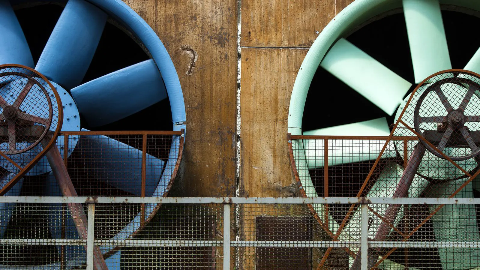 Technician inspecting a desiccant dryer vessel in an industrial plant