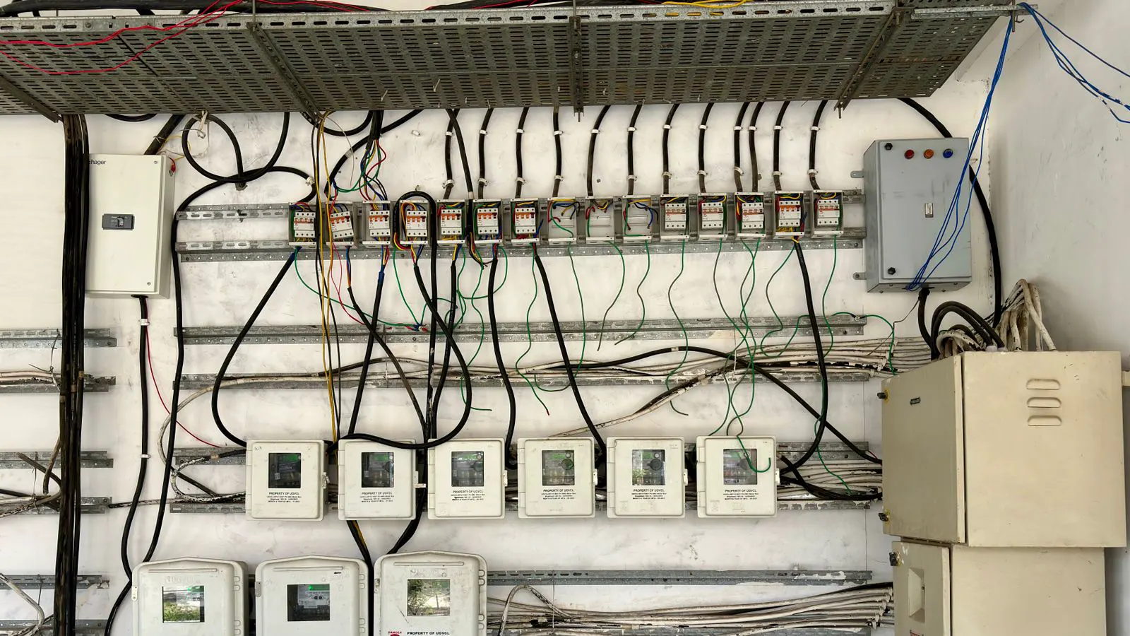 Digital display showing power consumption on an industrial compressor controller.
