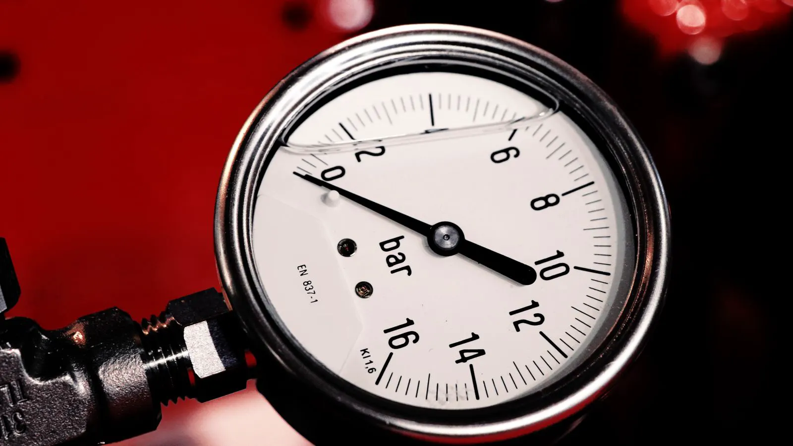 Close up of pressure gauges on an industrial extruder machine
