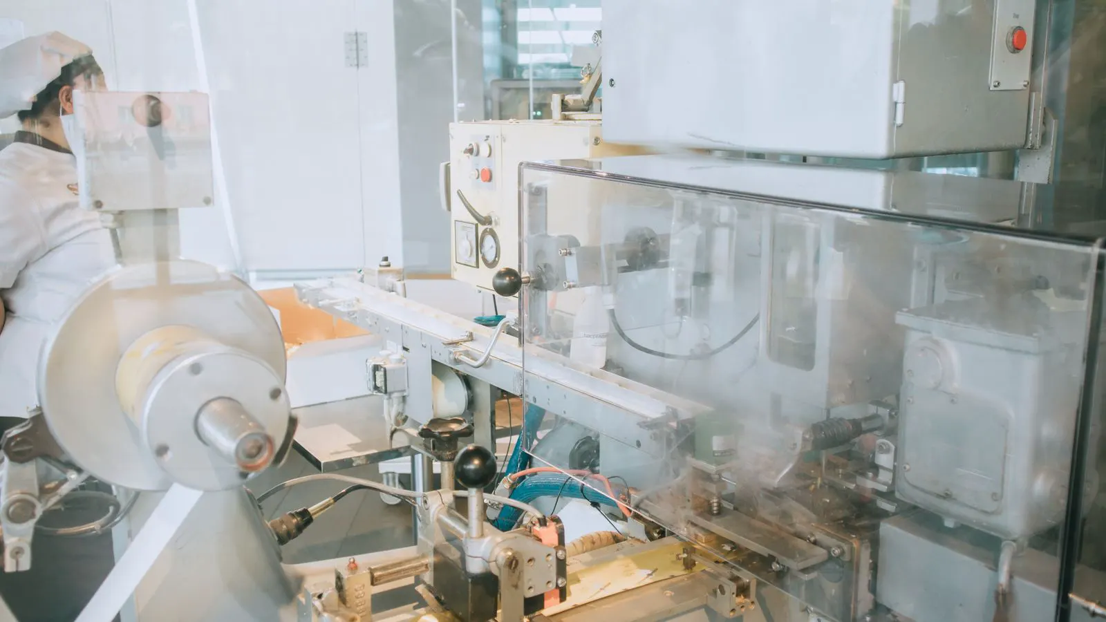 Close-up of an engineer inspecting a blow molding machine mold