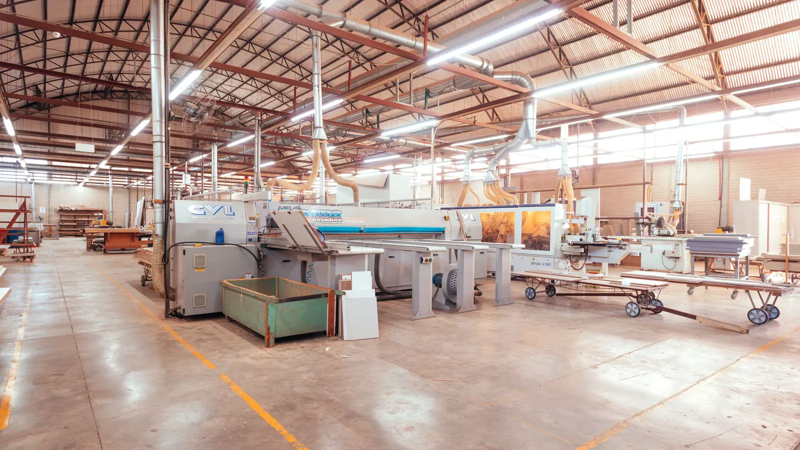 A new blow molding machine sits in a factory waiting for inspection.