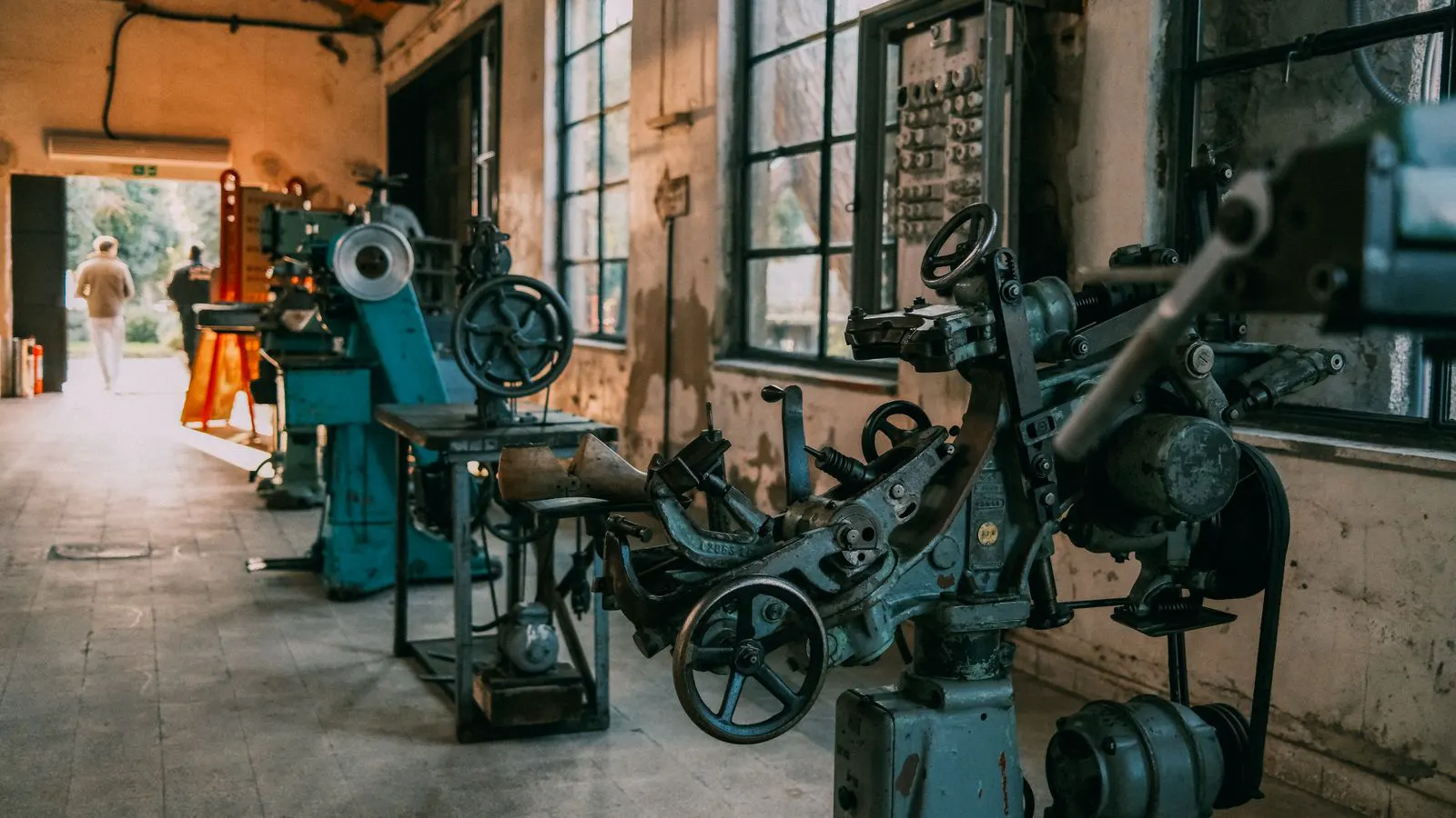 Engineer inspecting a machine during routine maintenance