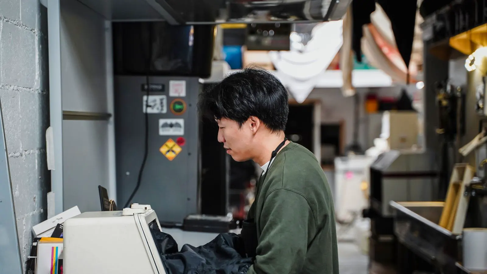 Technician reviewing machine interface during a scheduled maintenance inspection