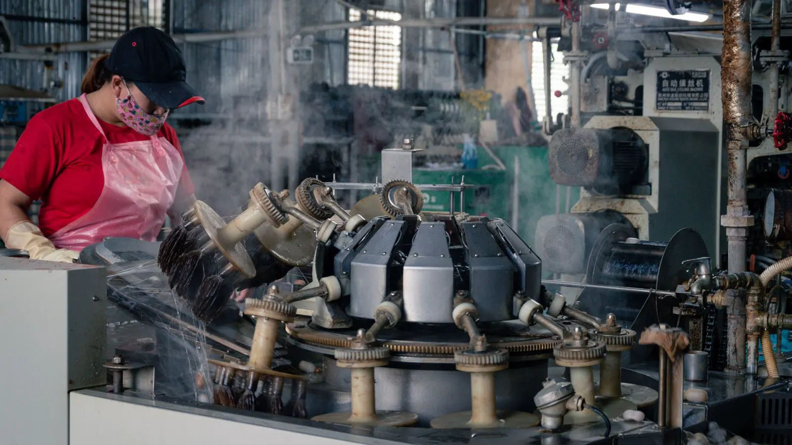 A modern blow molding machine in a factory setting