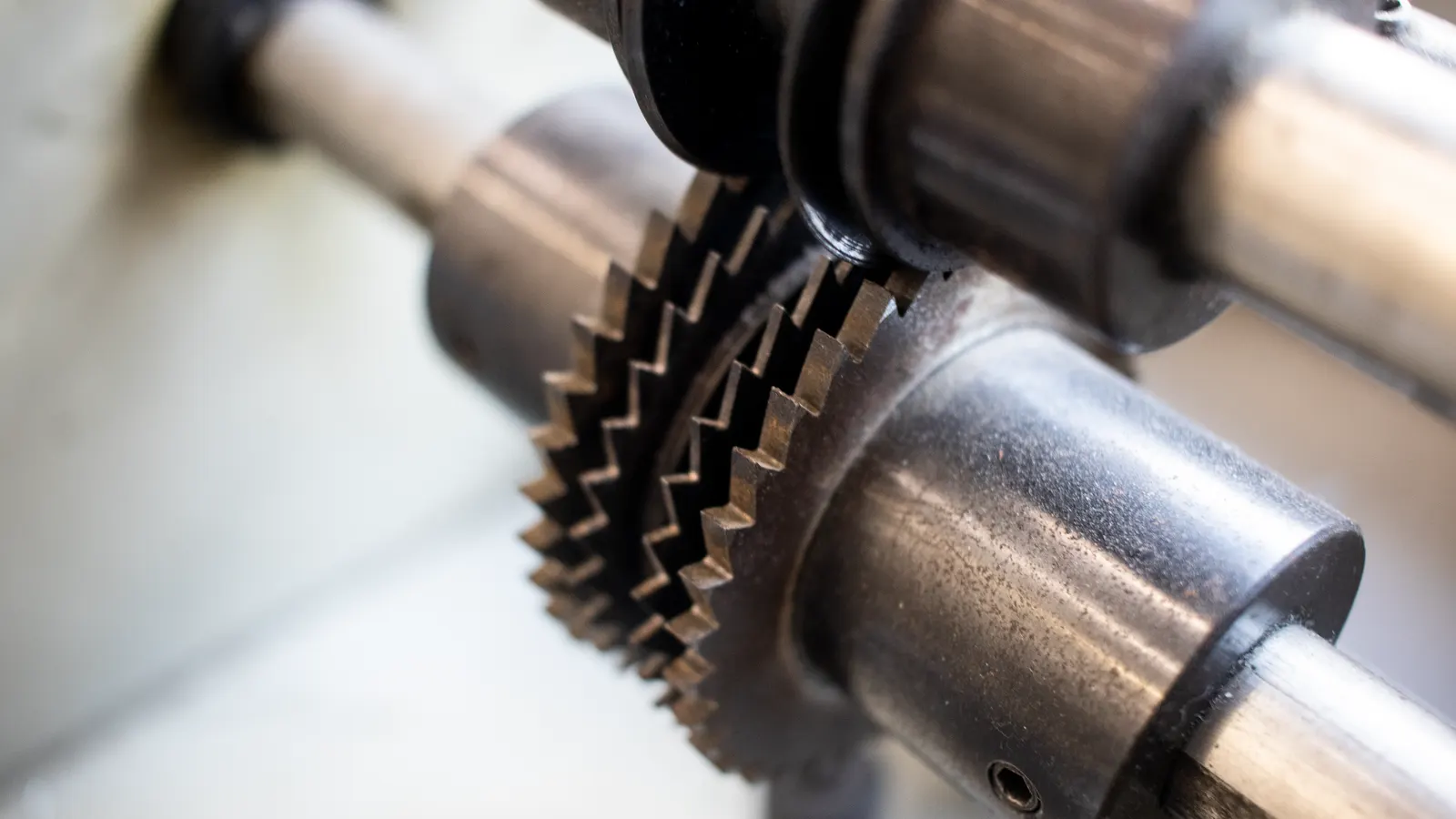 A polished metal extrusion die section showing the orifice and cooling channels.