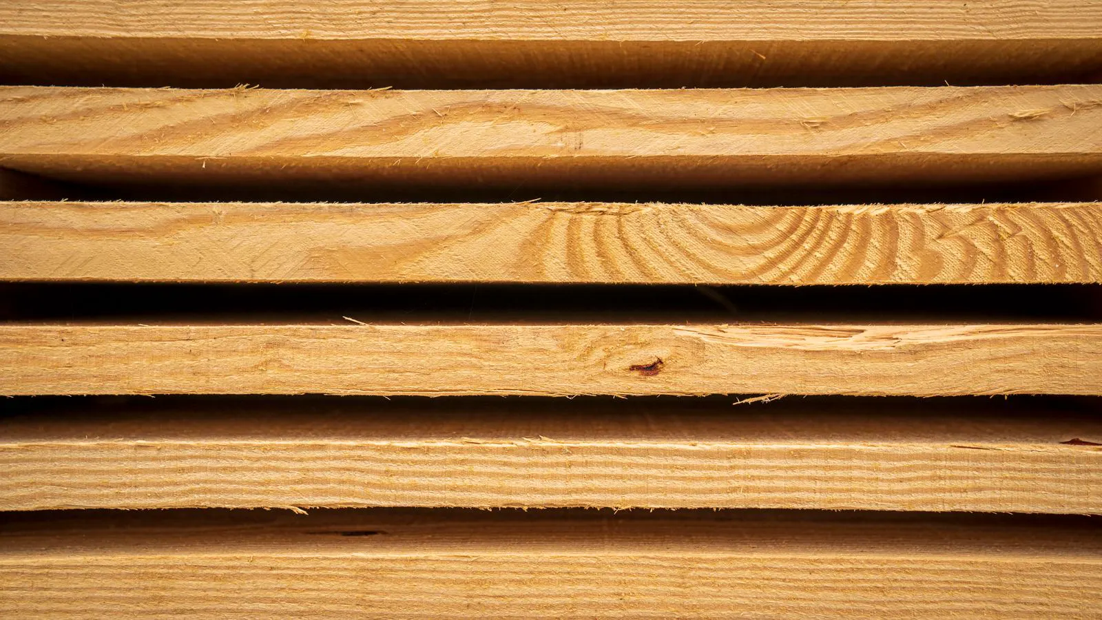 CNC router cutting dense hardwood material with visible chips