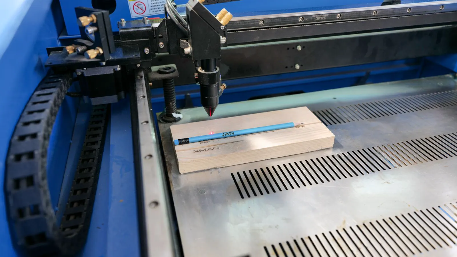 A professional edge banding machine processing wooden panel edges