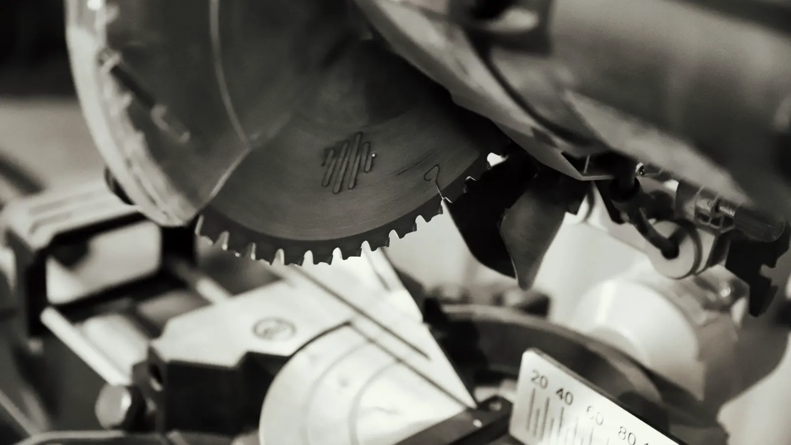 A large industrial panel saw with a long blade in a factory setting.