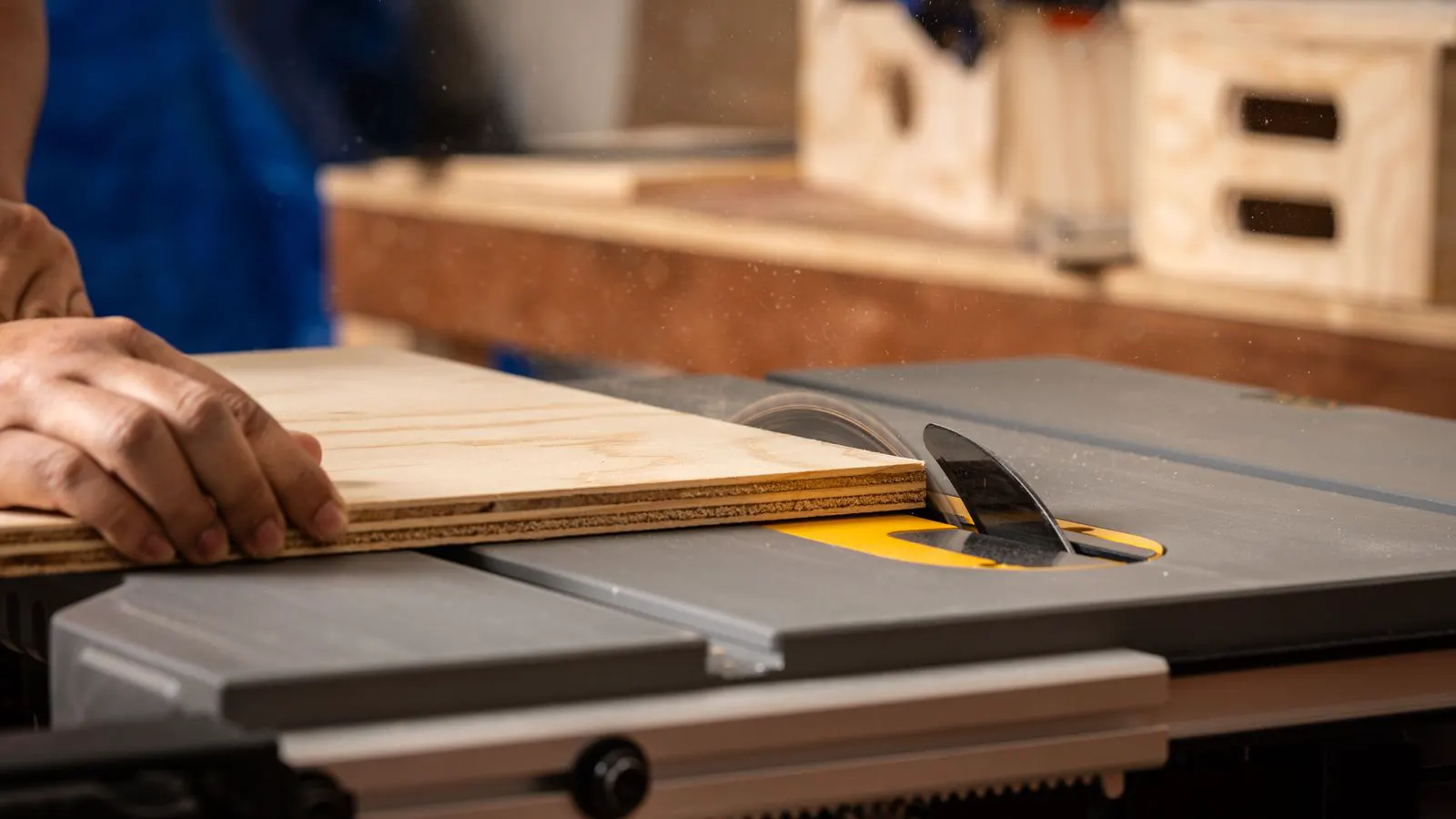 Technician checking band saw blade tension with a gauge