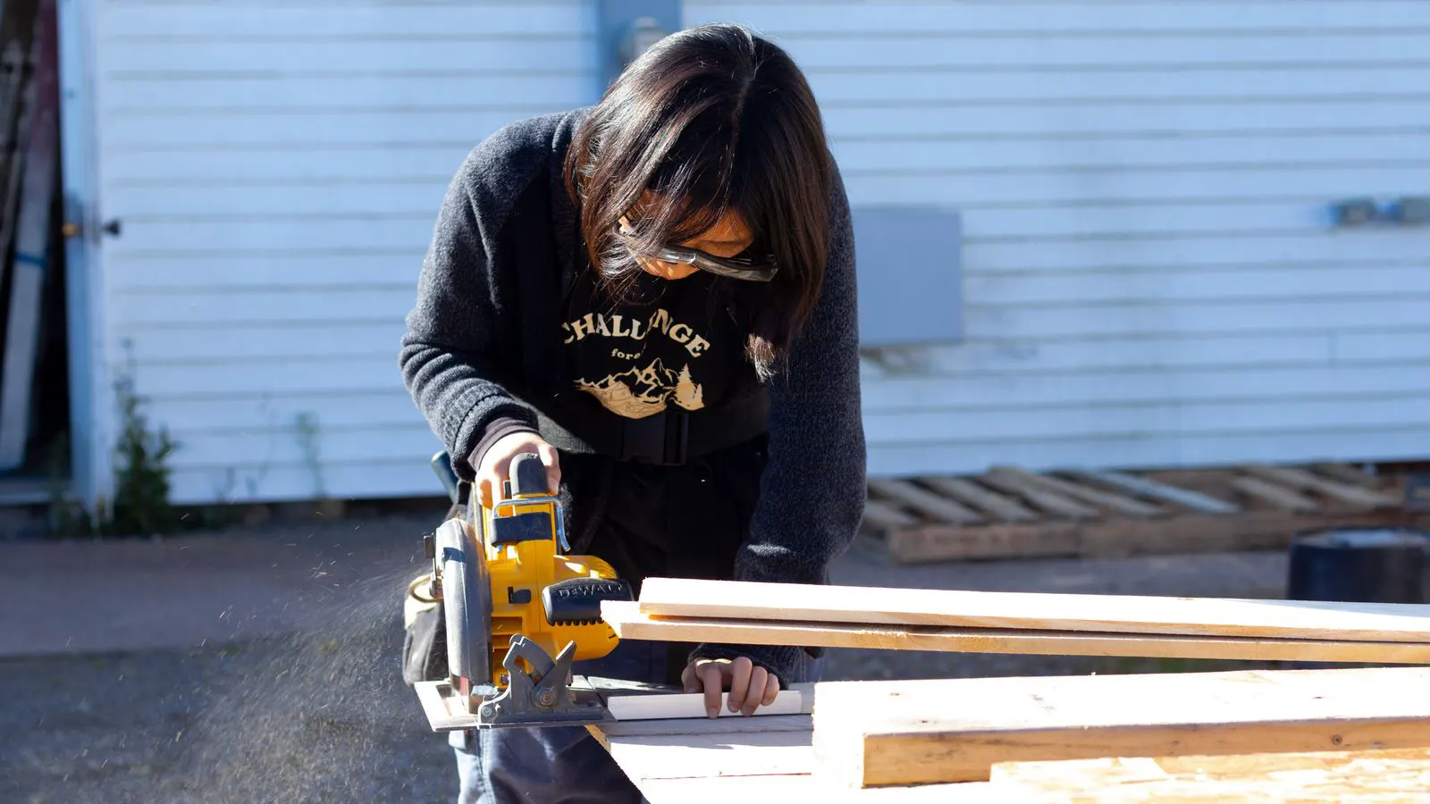 A close-up view of a metal safety guard on a table saw.