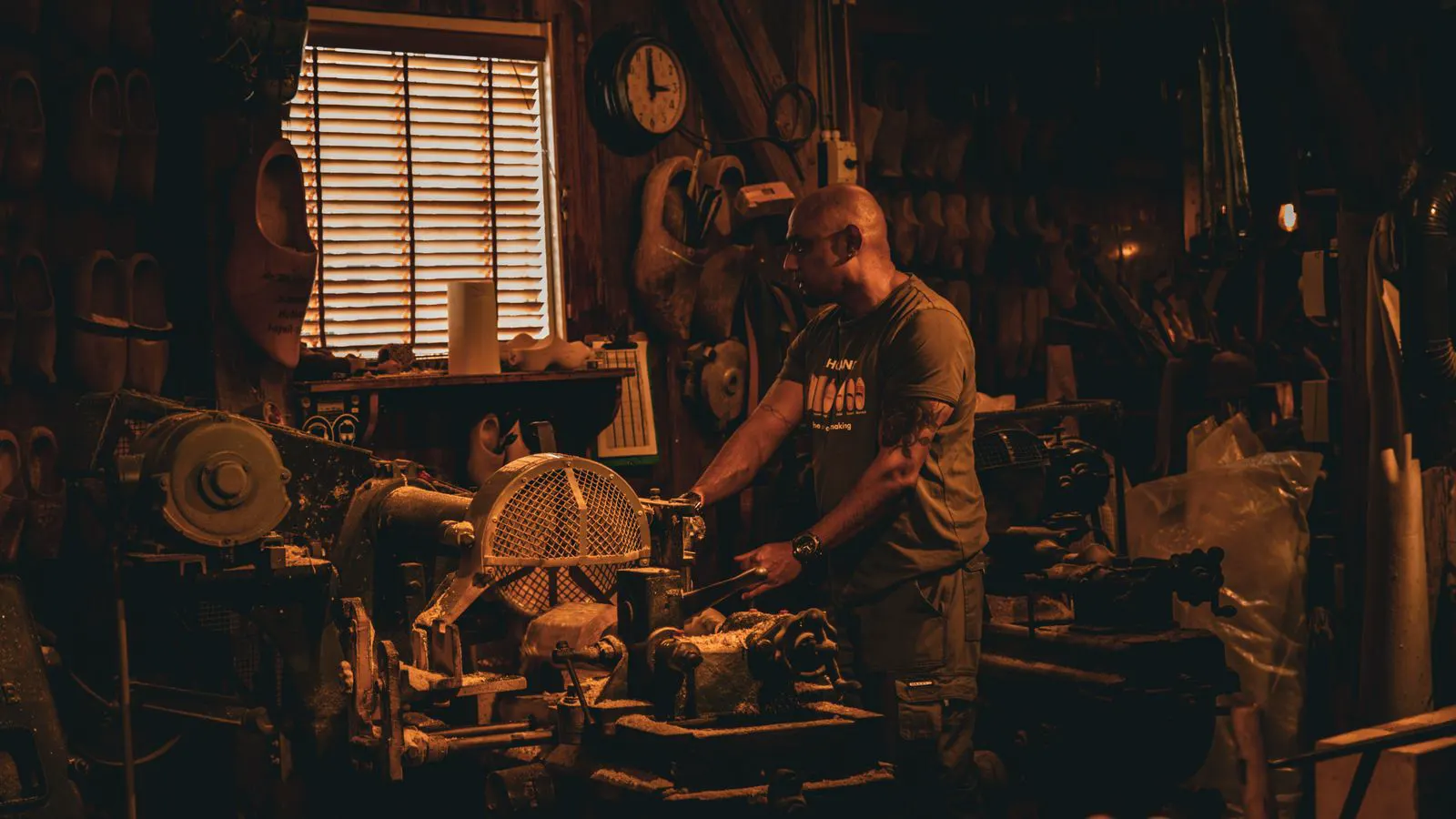 A large industrial woodworking machine sits in a clean factory floor