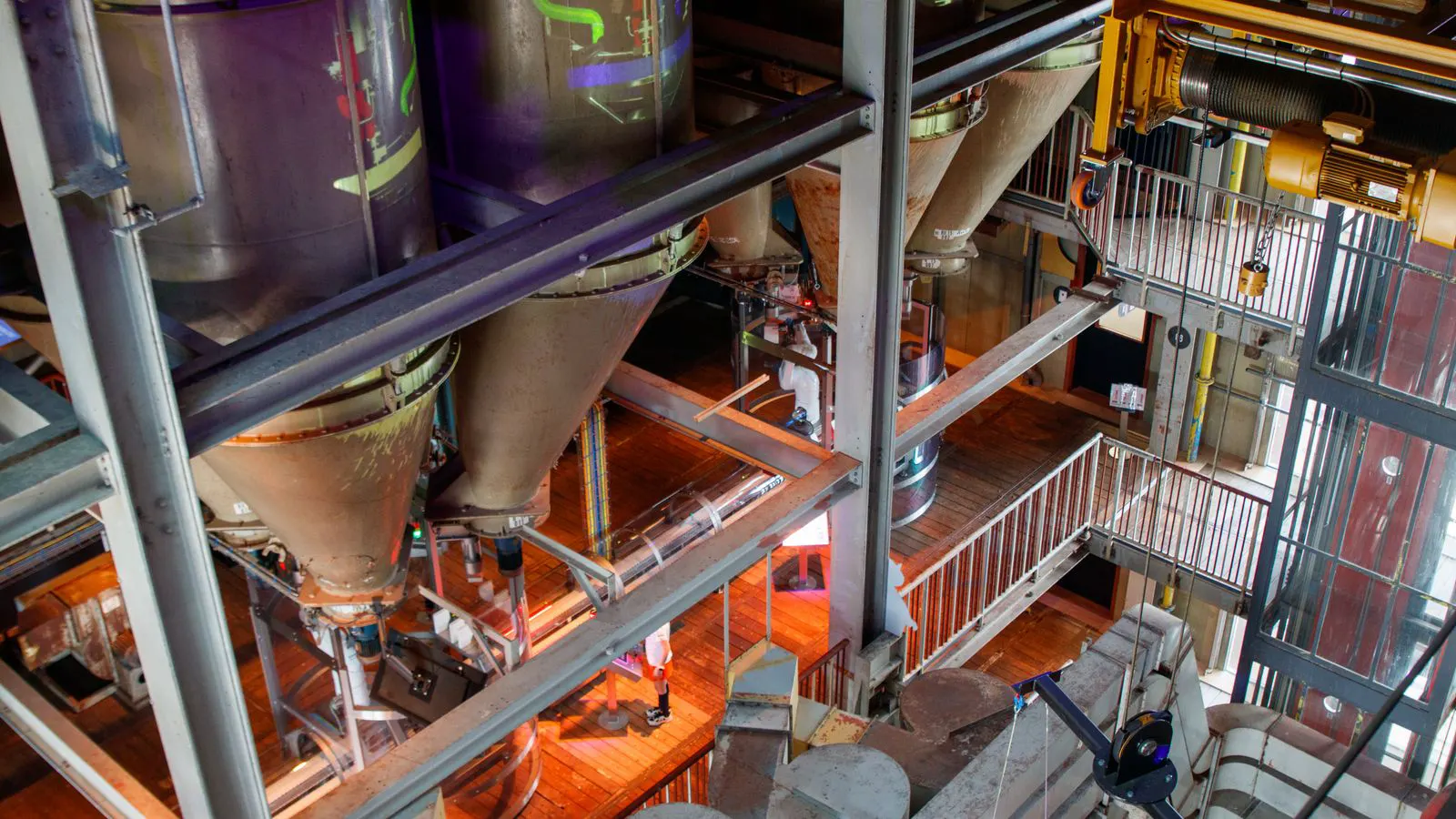 Baghouse and cyclone dust collector units installed in a workshop