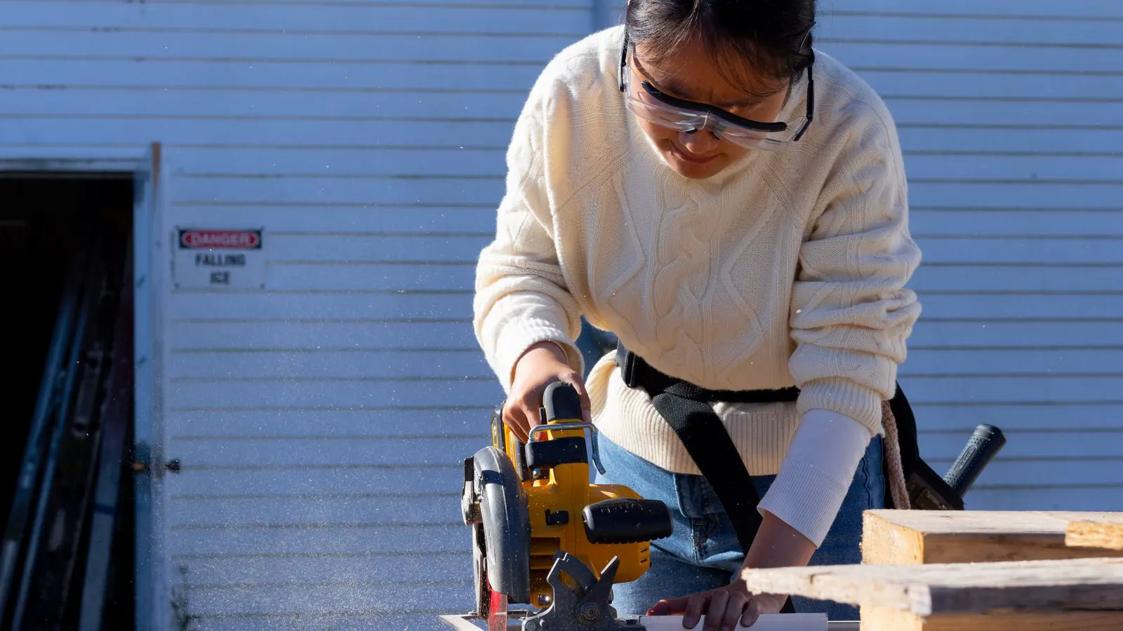 A professional woodworking shop with safety guards installed on a table saw.
