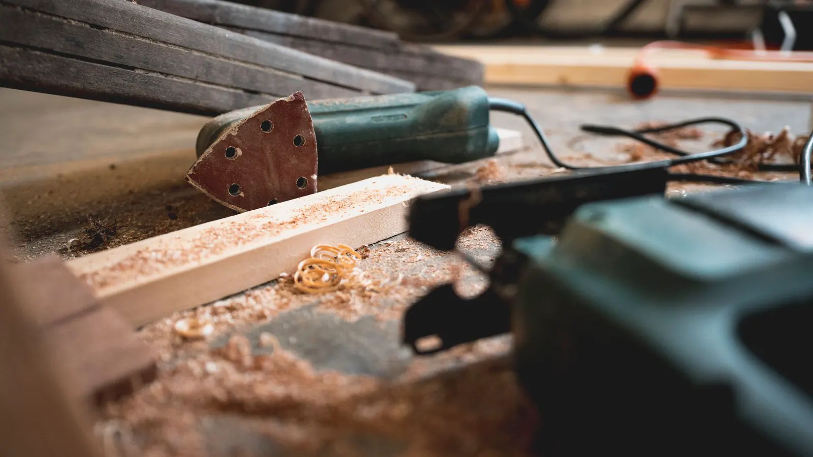 A modern industrial dust collector installed in a woodworking shop