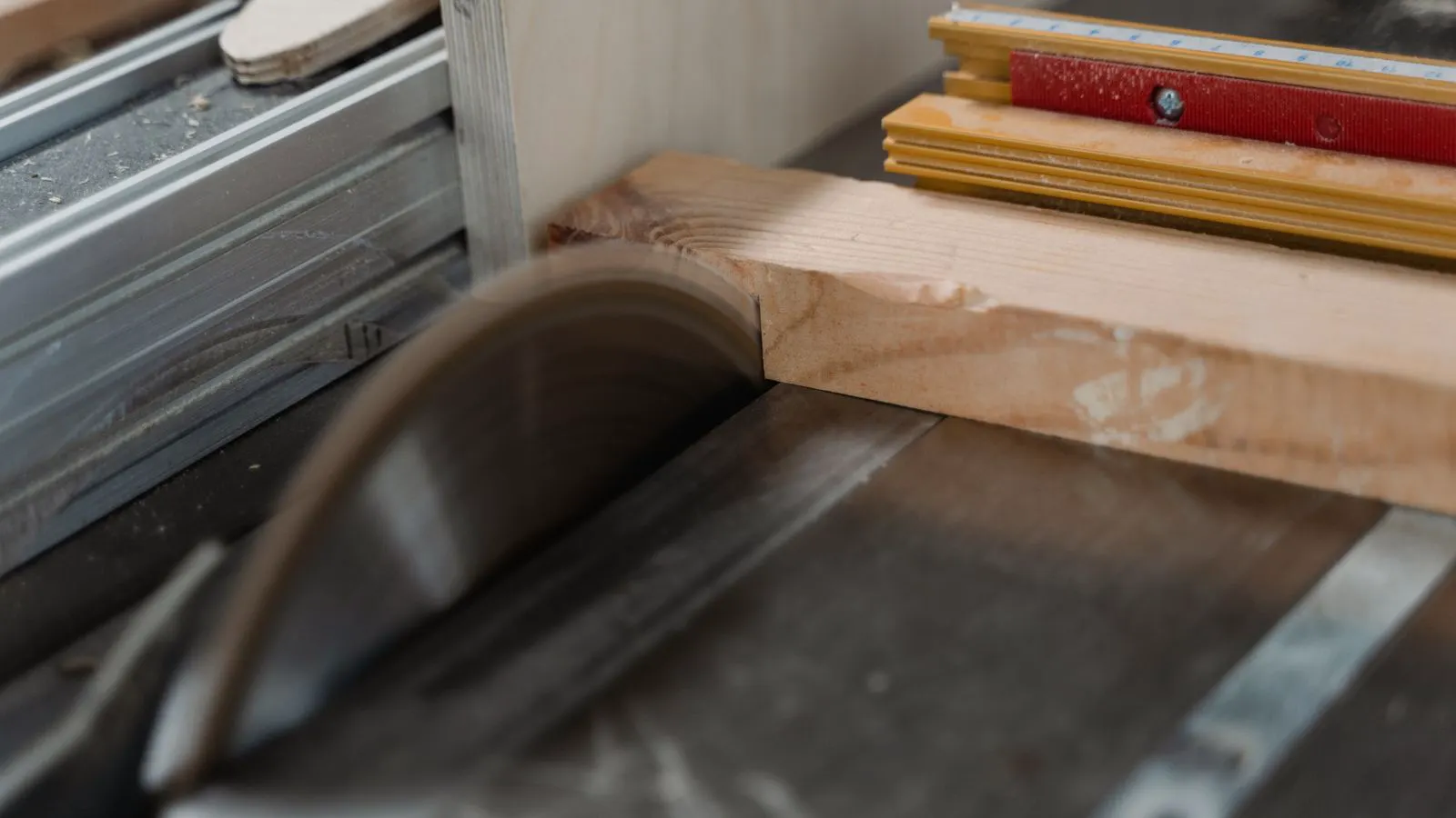 A circular saw blade resting on a wooden workbench