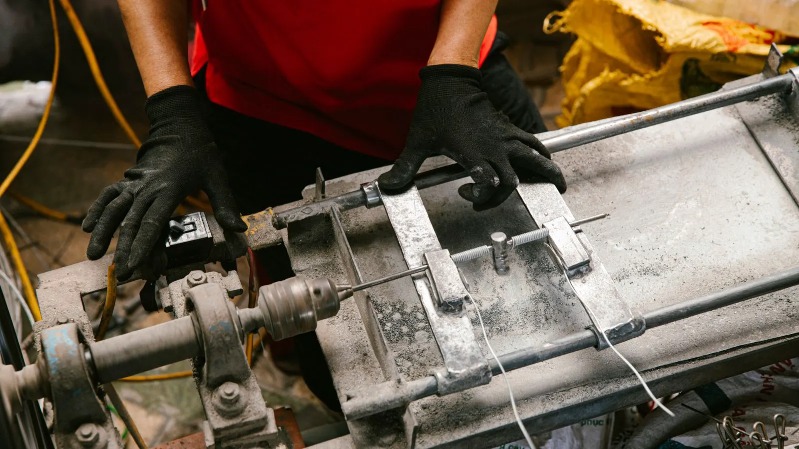 A technician reviews live machine data on a tablet in a workshop.