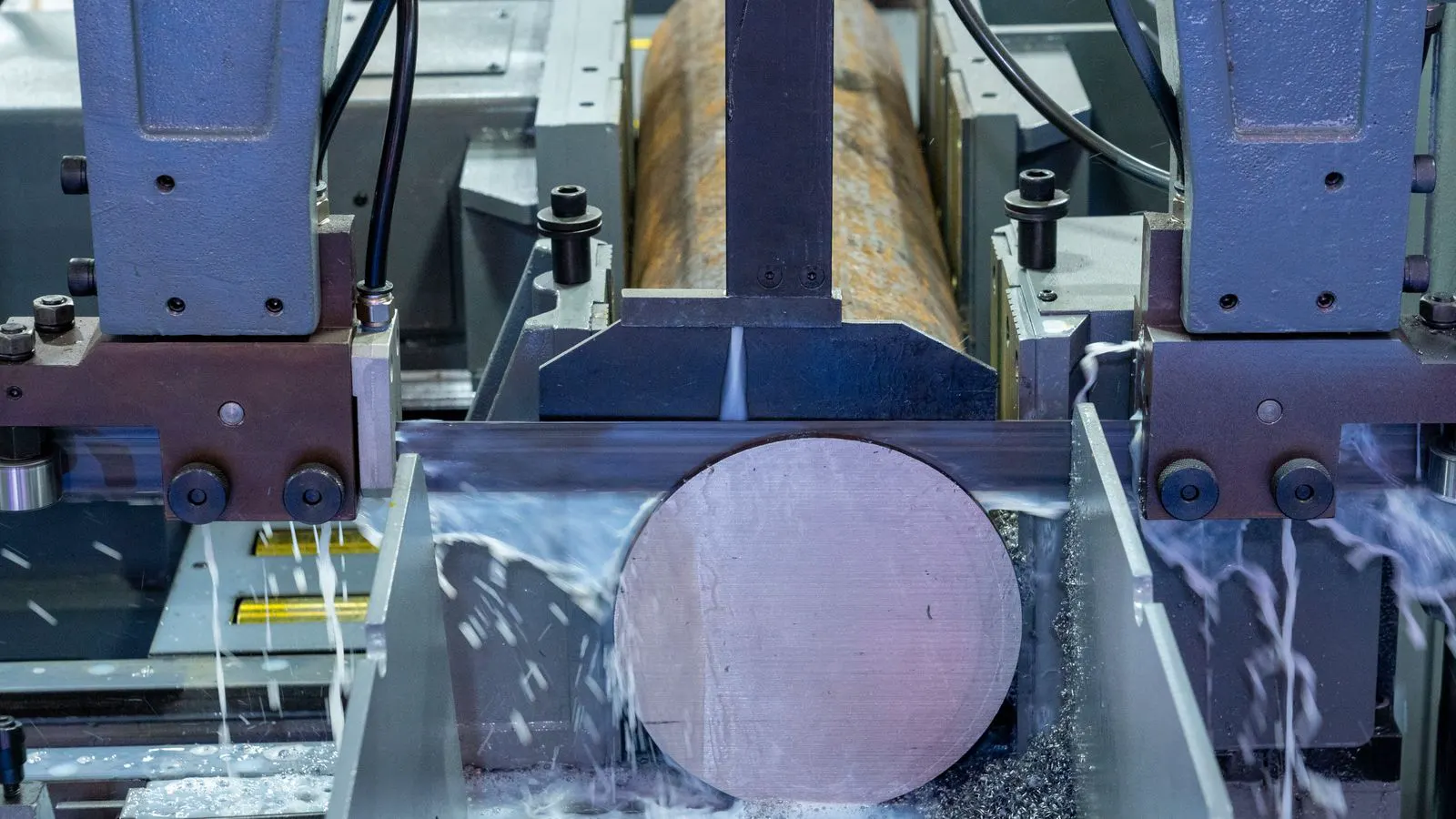 A CNC machine tool cutting a small metal component
