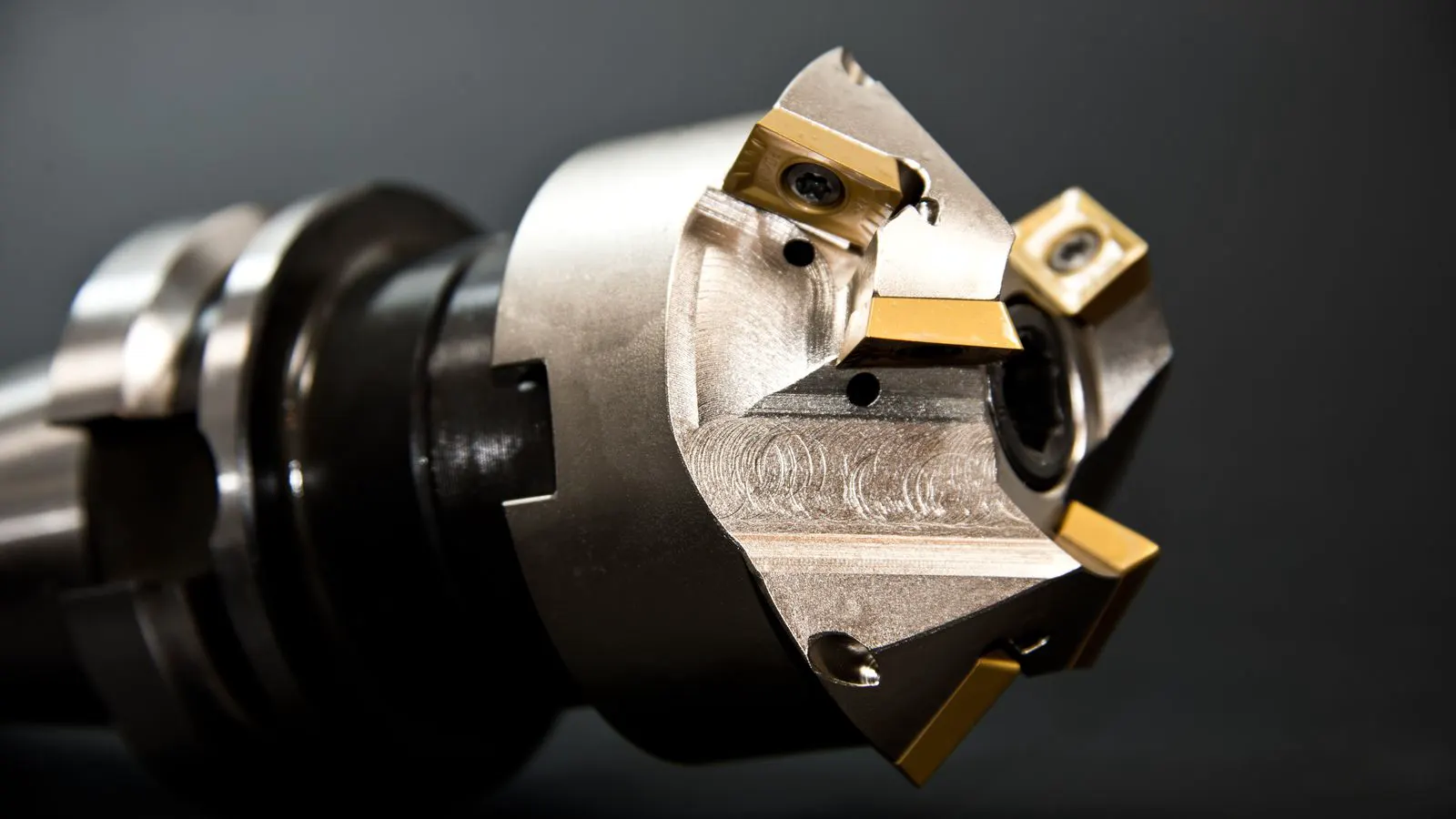 A CNC mill cuts a precision metal component during production.