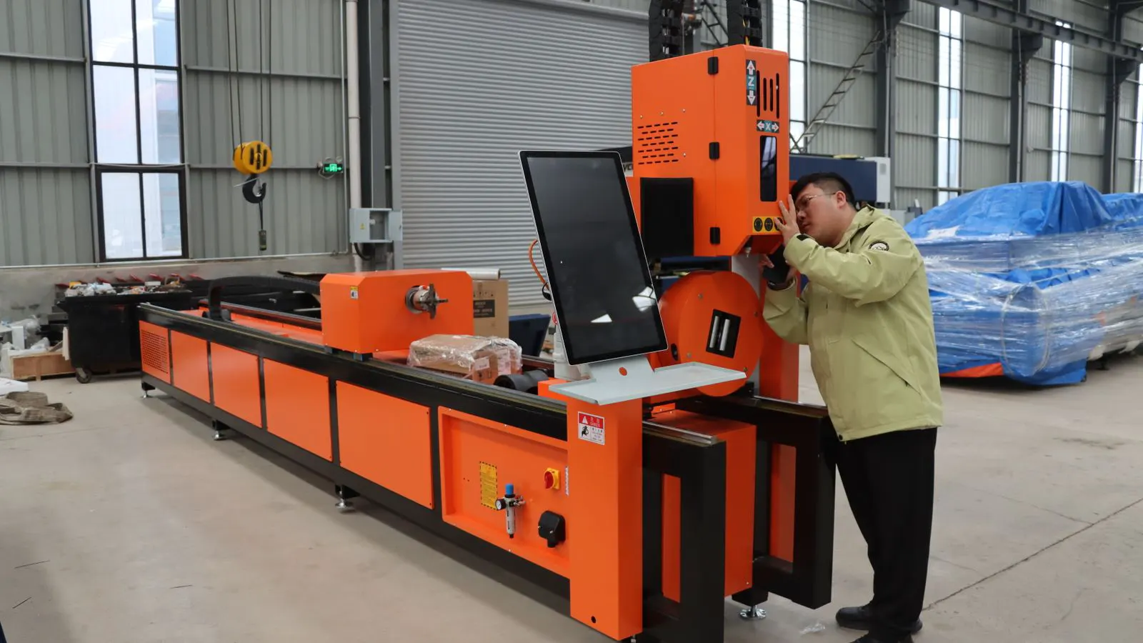 Engineer inspecting a machined part on a calibration bench