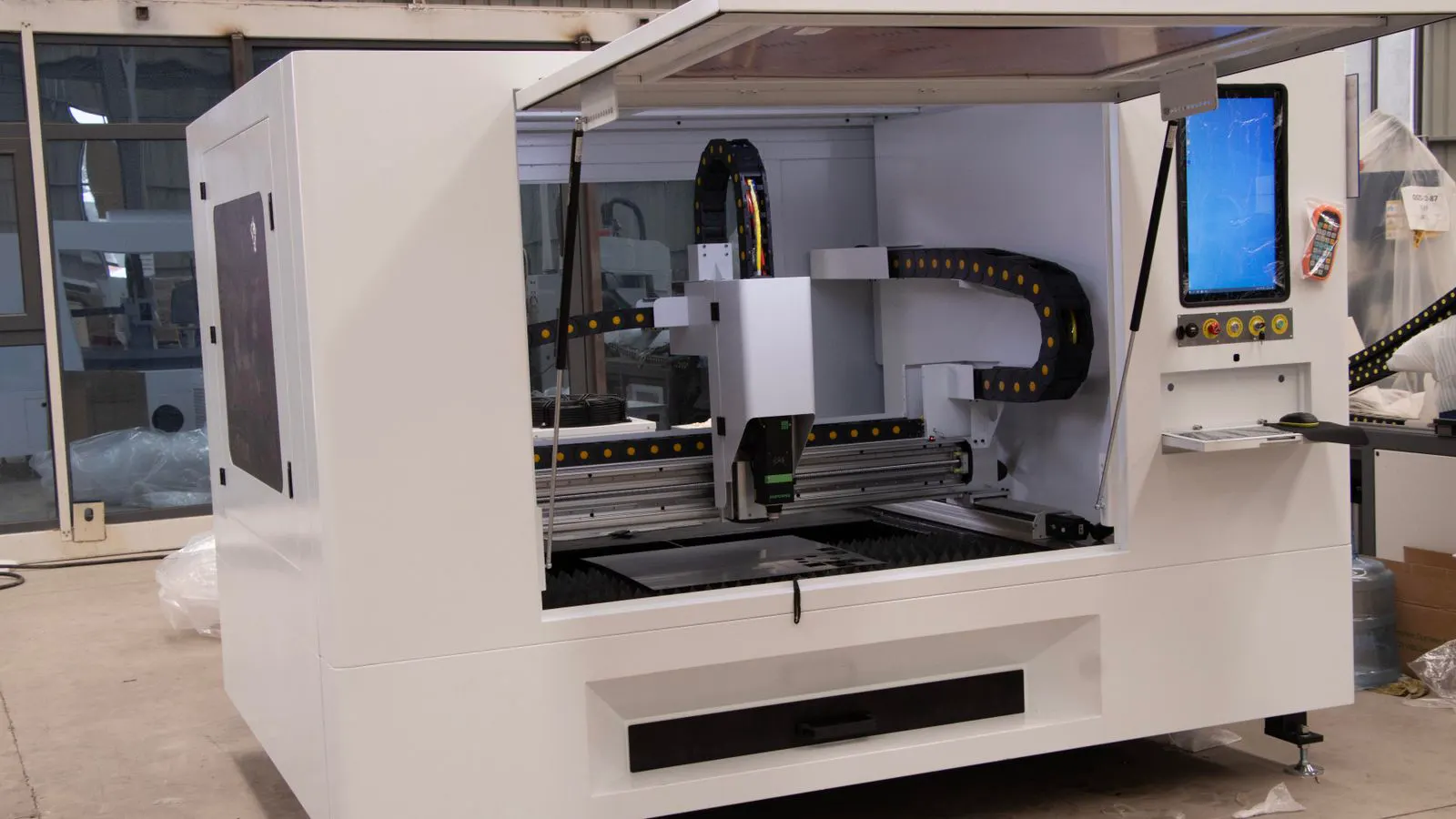 A precision CNC machining center running parts in a clean manufacturing shop.
