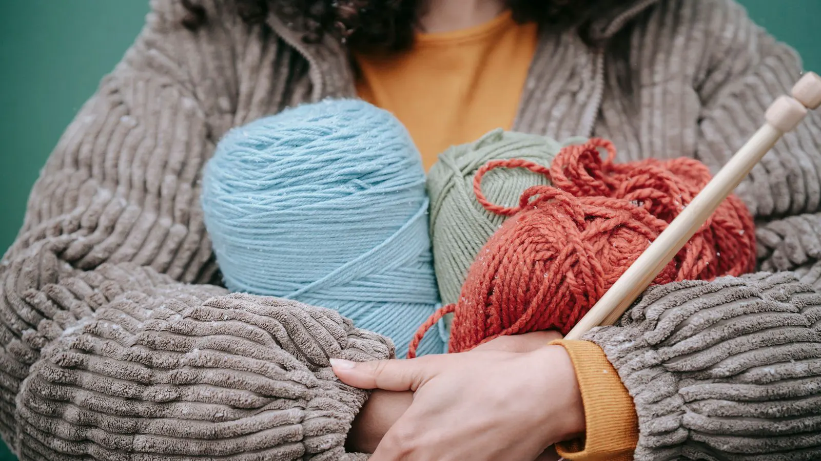 close up view of yarn feeding on a knitting machine