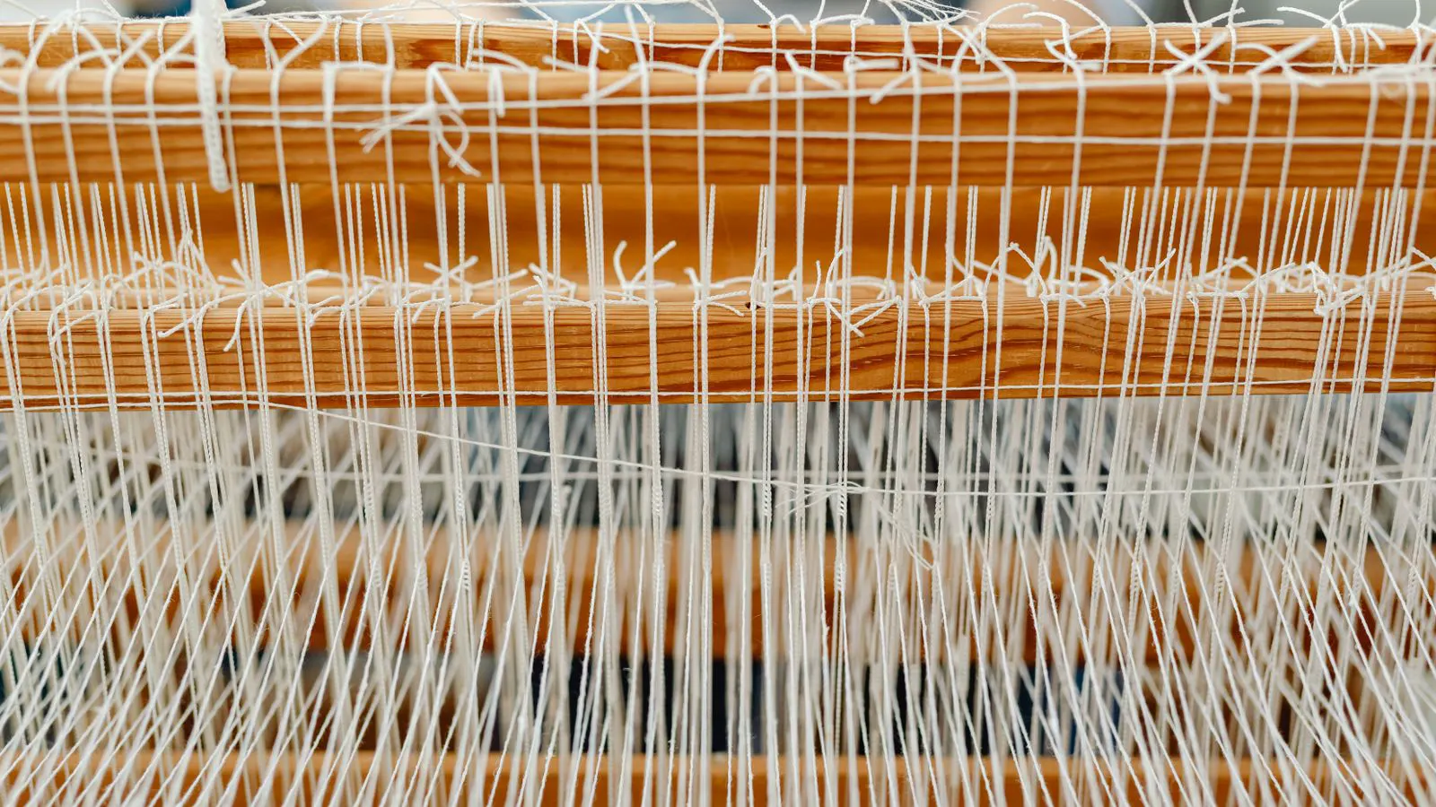 A close up of a loom showing mounted sensors and wiring
