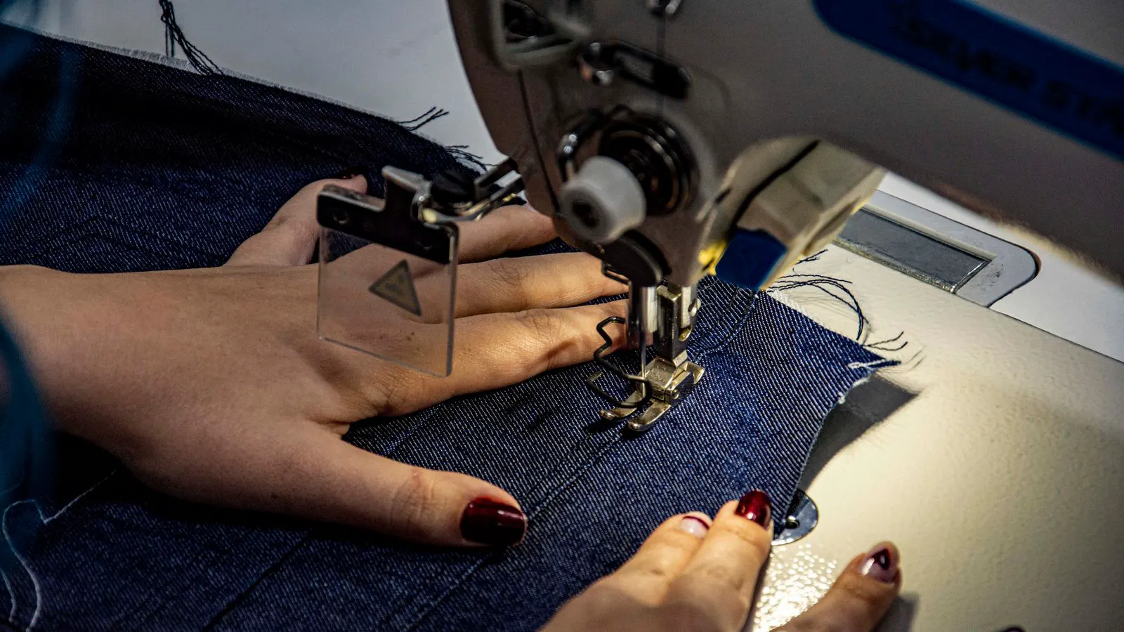 close view of a stitched seam on a fabric panel
