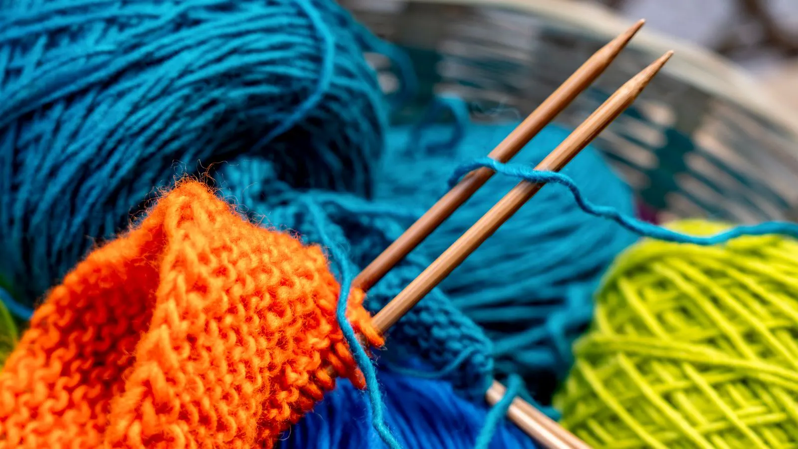 Close up of metal needles on a circular knitting machine.
