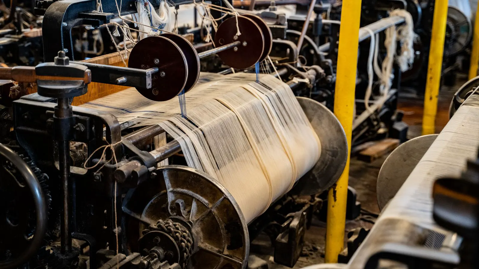 A technician inspecting a spindle assembly during scheduled machine service.