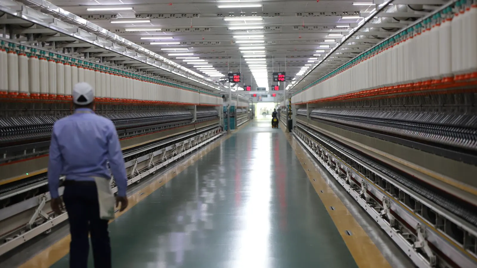 Close up of a spinning frame machine with cotton yarn